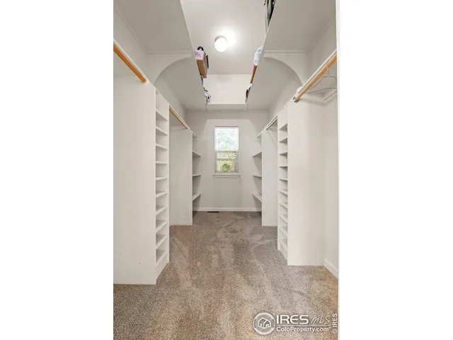 a view of a hallway with white walls