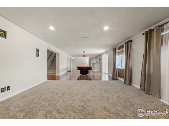 a room with furniture and wooden floor