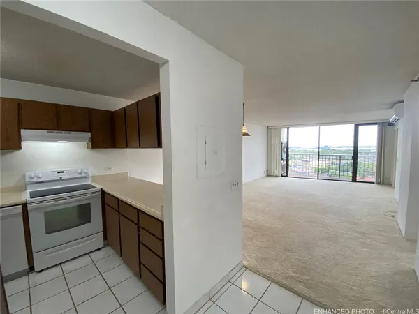 a kitchen with a stove a sink and a refrigerator