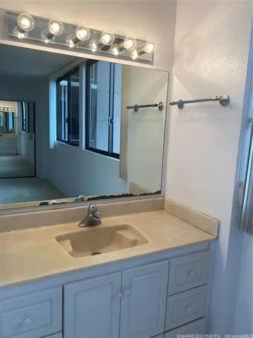 a bathroom with a sink and a mirror