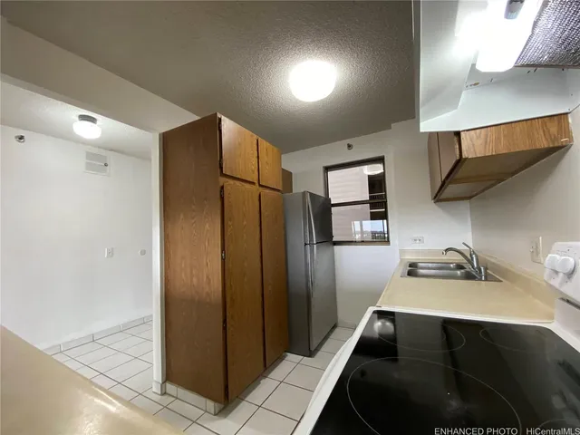 a kitchen with stainless steel appliances a refrigerator and a sink