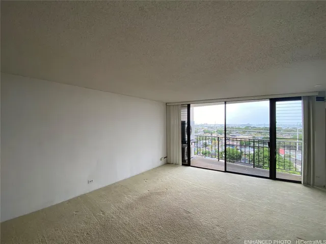 a view of an empty room with windows