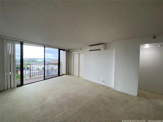 a view of an empty room with a balcony
