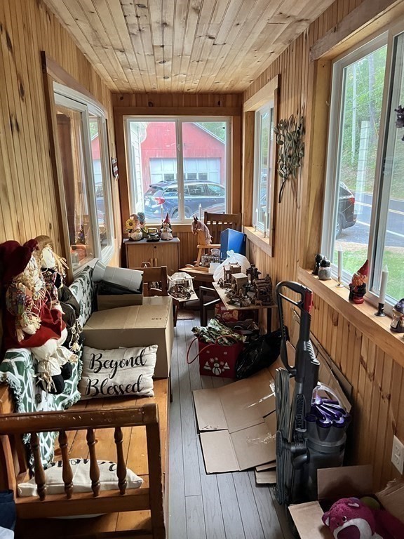 25 Main Road Phillipston, MA 01331 - Photo 16 of 42 a living room with furniture and large windows