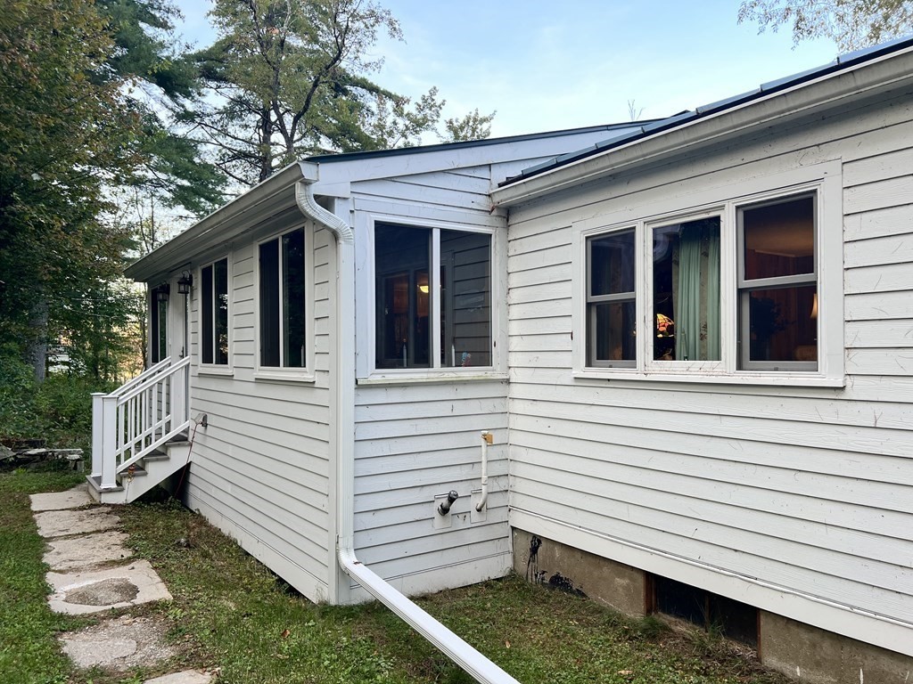 25 Main Road Phillipston, MA 01331 - Photo 2 of 42 a view of a white house with a yard and stairs