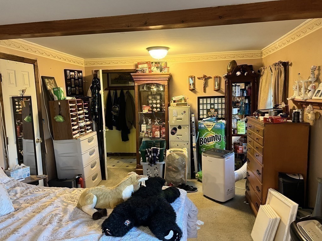 25 Main Road Phillipston, MA 01331 - Photo 23 of 42 a bedroom with a bed and wooden floor