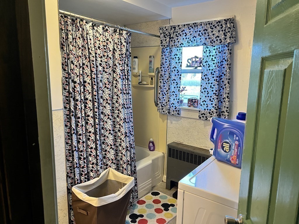 25 Main Road Phillipston, MA 01331 - Photo 24 of 42 a bathroom with a sink a toilet and shower curtain