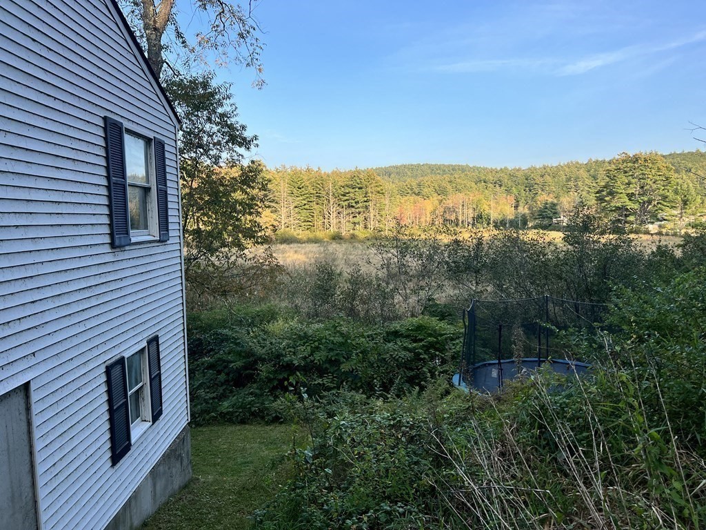 25 Main Road Phillipston, MA 01331 - Photo 4 of 42 a view of a houses with a green space