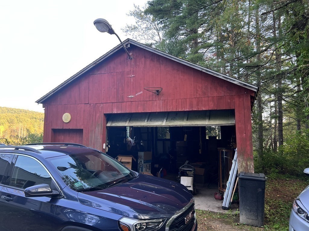 25 Main Road Phillipston, MA 01331 - Photo 9 of 42 a table and chairs in front of a house