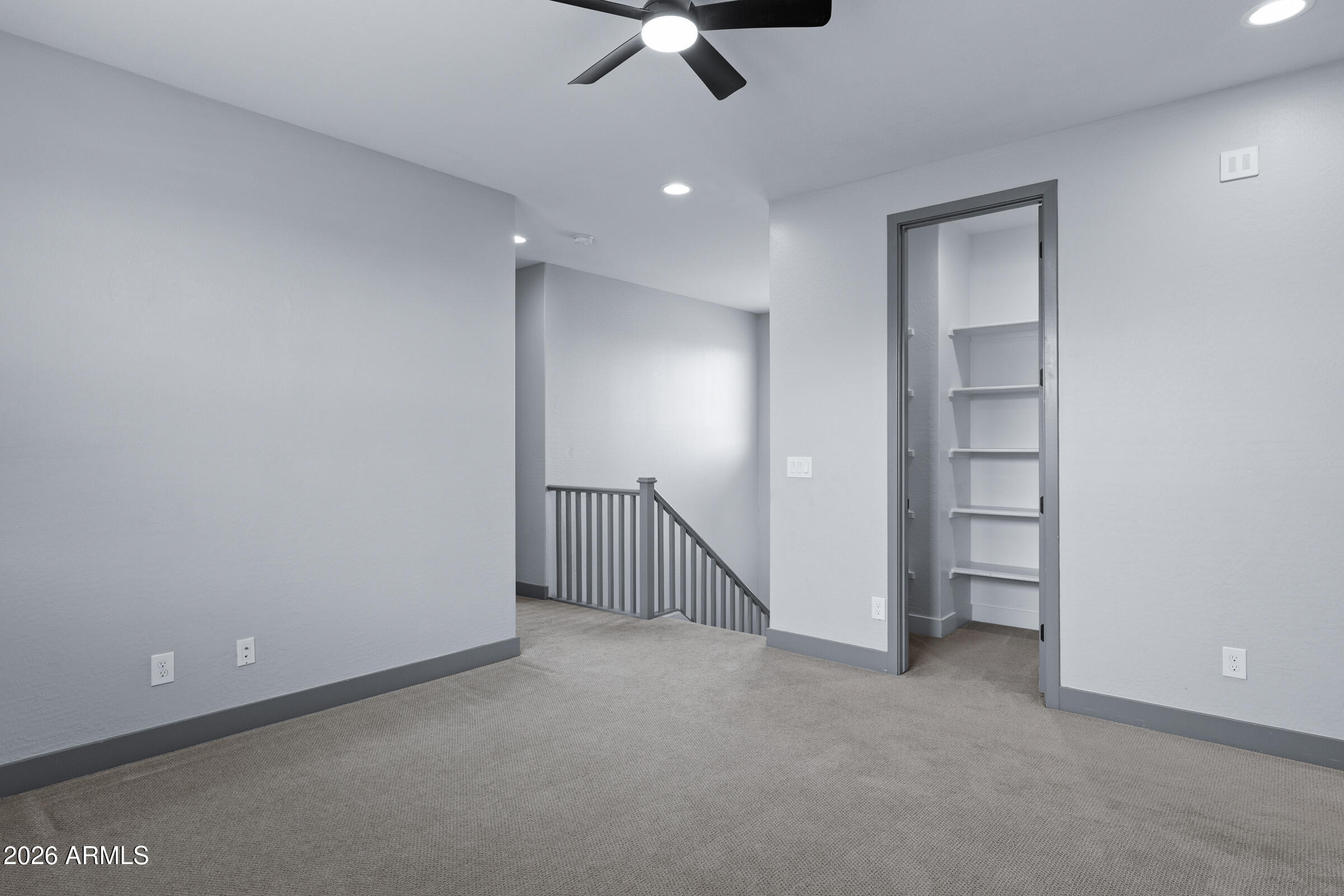 3900 East Appaloosa Road Gilbert, AZ 85296 - Photo 21 of 38 an empty room with a ceiling fan & windows