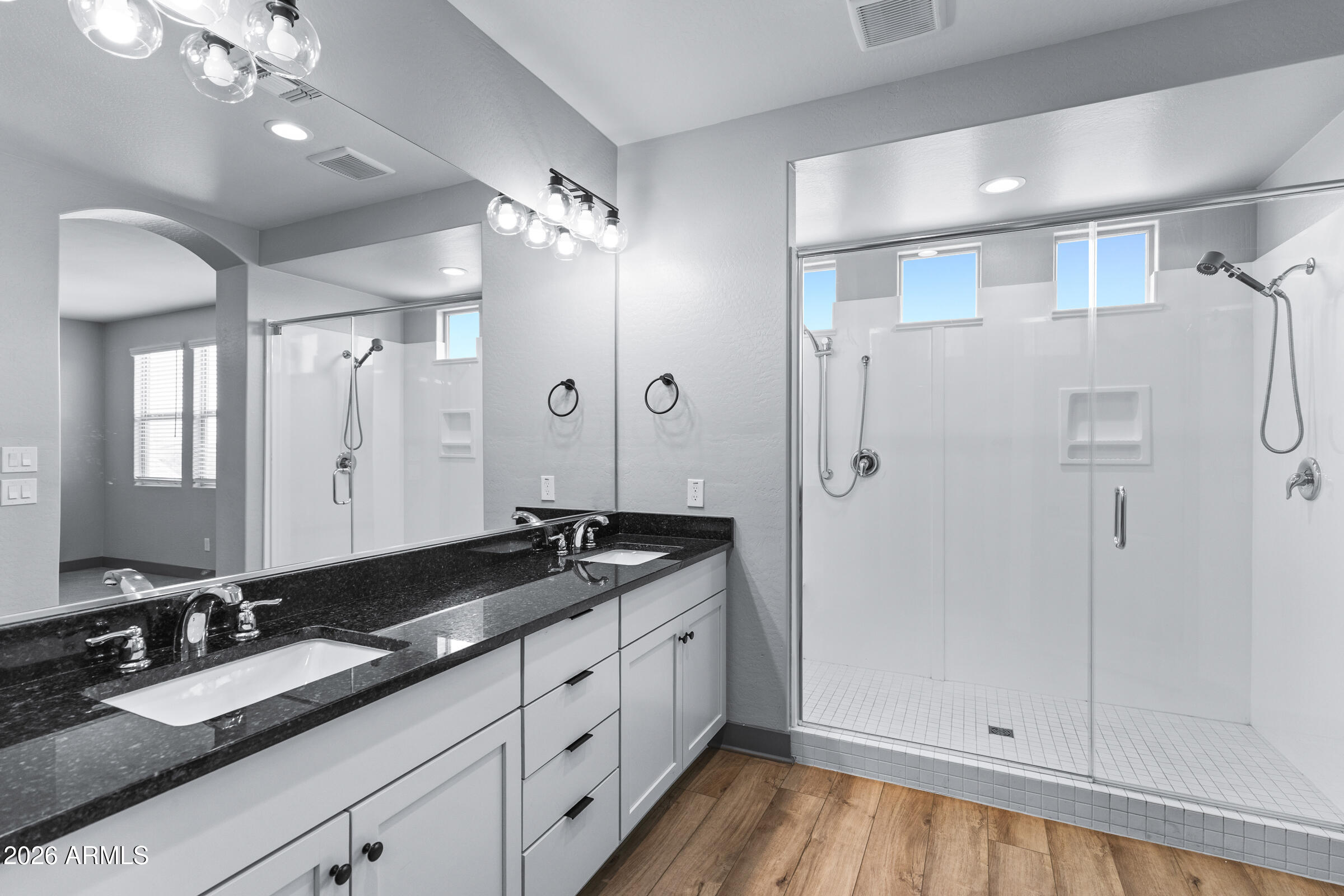 3900 East Appaloosa Road Gilbert, AZ 85296 - Photo 26 of 38 a spacious bathroom with a granite countertop sink mirror and double