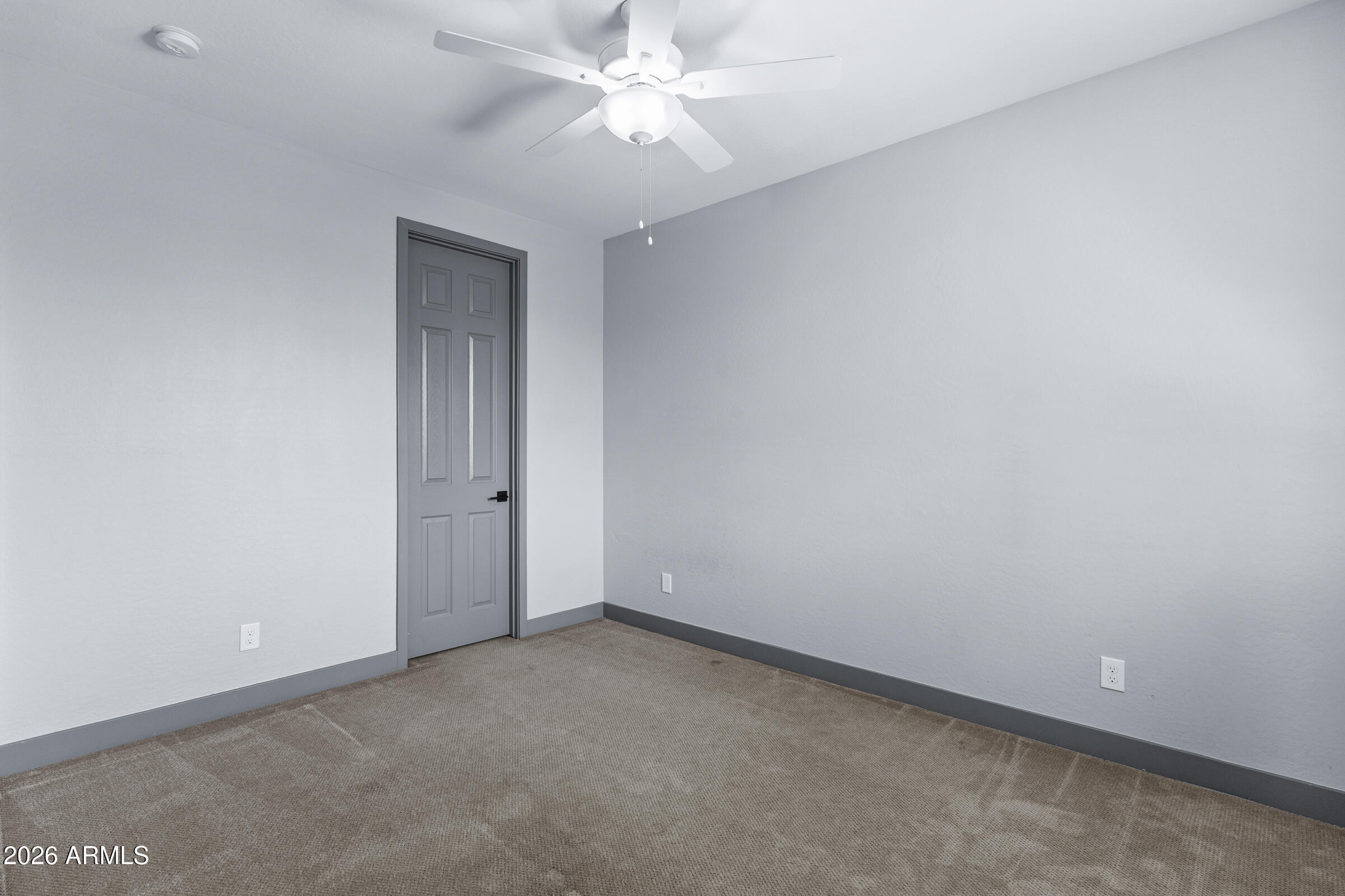 3900 East Appaloosa Road Gilbert, AZ 85296 - Photo 30 of 38 an empty room with a ceiling fan and a window