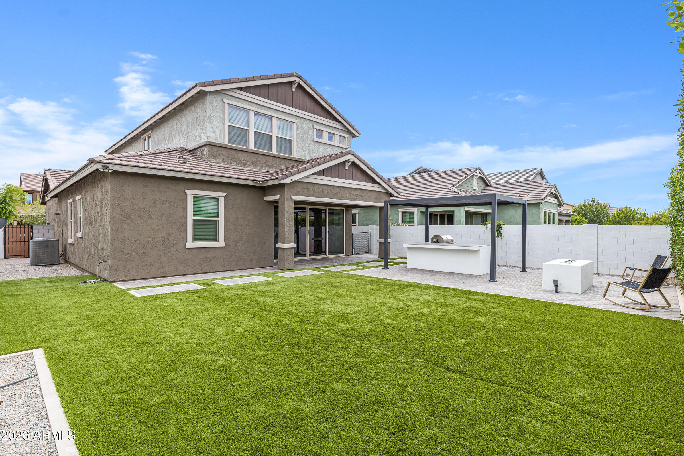 3900 East Appaloosa Road Gilbert, AZ 85296 - Photo 35 of 38 a front view of a house with a garden and porch