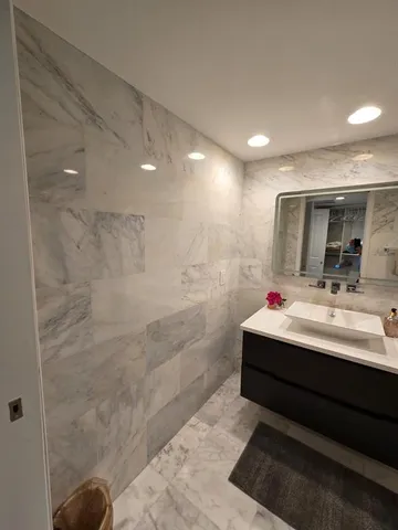 a bed room with a bed and a television