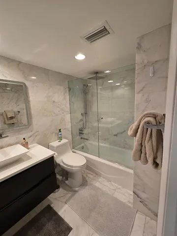 a bedroom with a bed and dresser