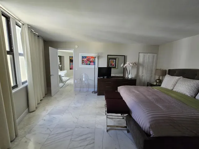 a bathroom with a shower and toilet