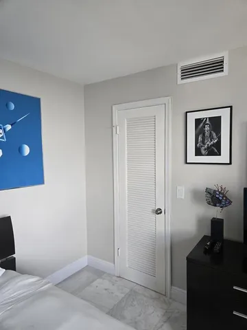 a living room with furniture and a ceiling fan
