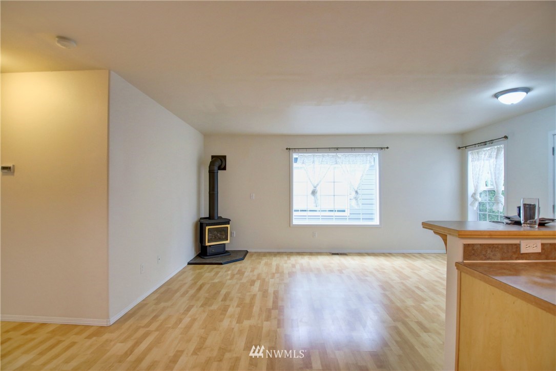 885 Cook Road, Unit 6 Sedro-Woolley, WA 98284 - Photo 13 of 31 a room with a window and wooden floor