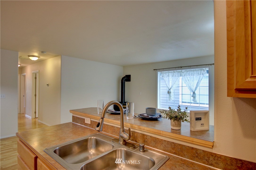 885 Cook Road, Unit 6 Sedro-Woolley, WA 98284 - Photo 15 of 31 a kitchen with a sink a counter top space and a window