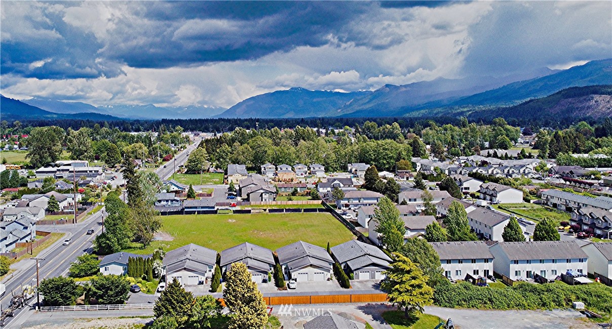 885 Cook Road, Unit 6 Sedro-Woolley, WA 98284 - Photo 3 of 31 an aerial view of a house with a garden and lake view