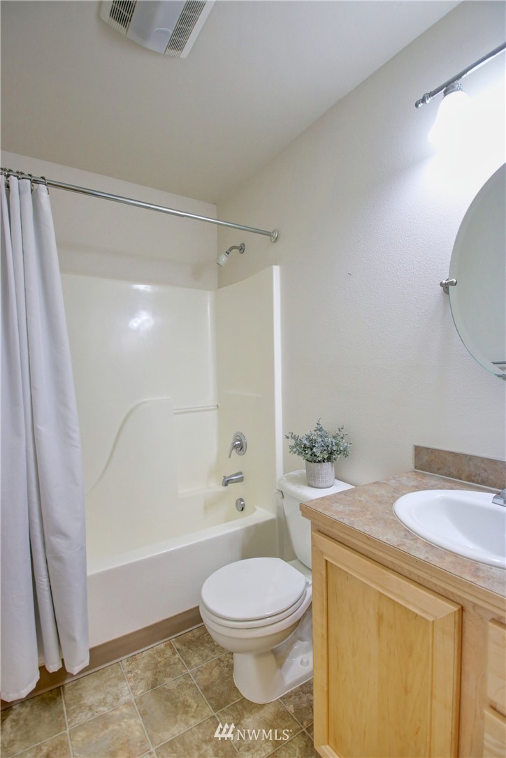 885 Cook Road, Unit 6 Sedro-Woolley, WA 98284 - Photo 22 of 31 a bathroom with a sink a toilet and shower