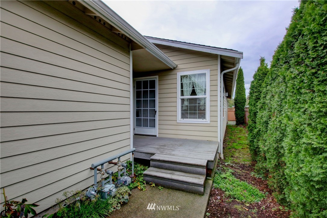 885 Cook Road, Unit 6 Sedro-Woolley, WA 98284 - Photo 28 of 31 a view of a house with a backyard