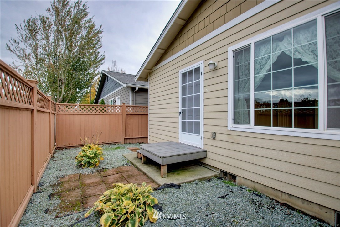 885 Cook Road, Unit 6 Sedro-Woolley, WA 98284 - Photo 29 of 31 a view of a backyard with chairs and a potted plant