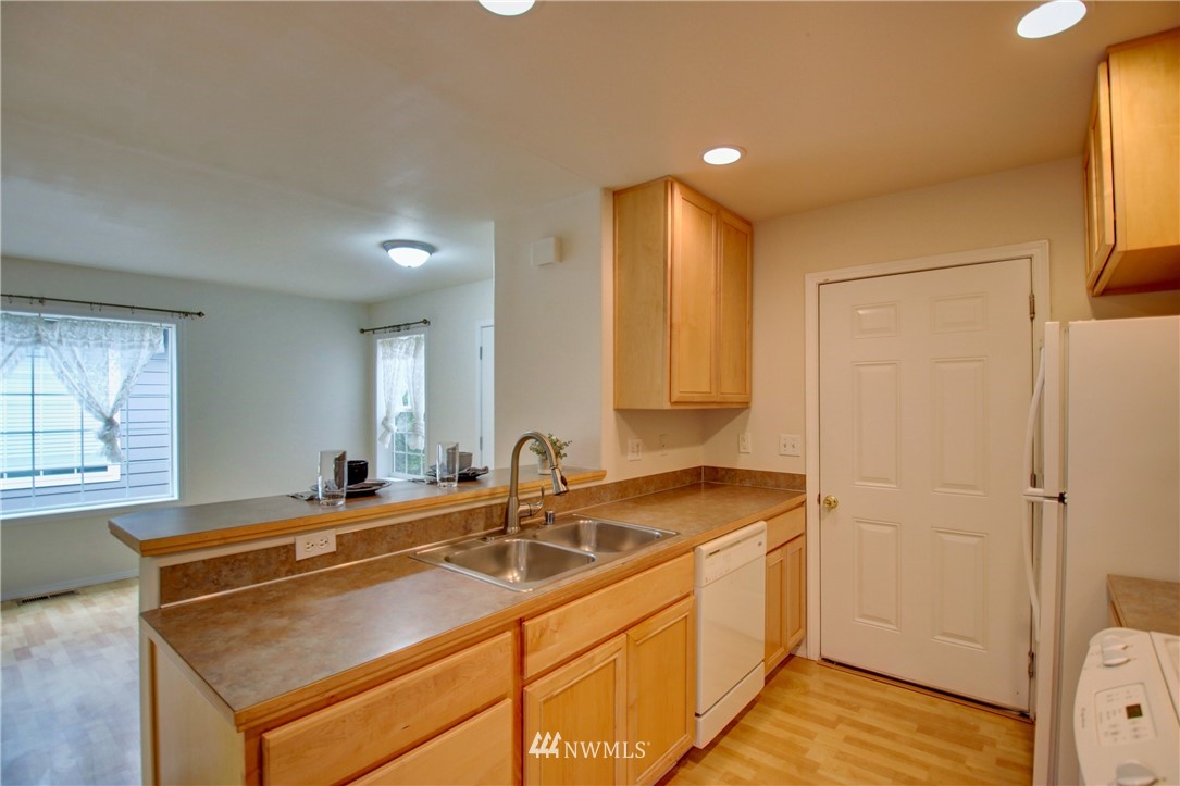 885 Cook Road, Unit 6 Sedro-Woolley, WA 98284 - Photo 6 of 31 a room with a sink cabinets and window