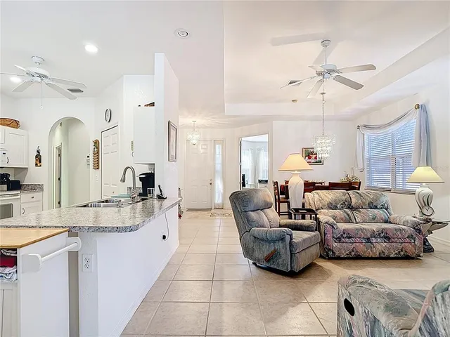 a kitchen with stainless steel appliances a refrigerator sink and cabinets