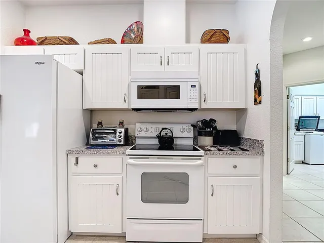 a bedroom with a bed and a mirror