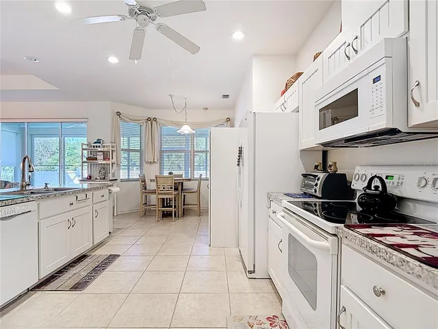 a bathroom with a shower sink and mirror