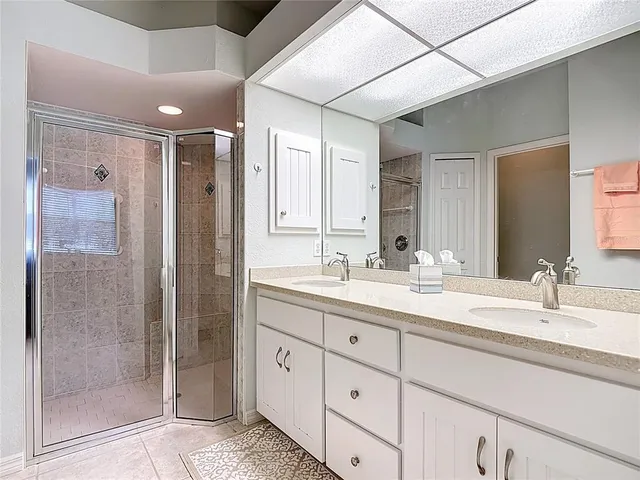 an aerial view of a house with a swimming pool