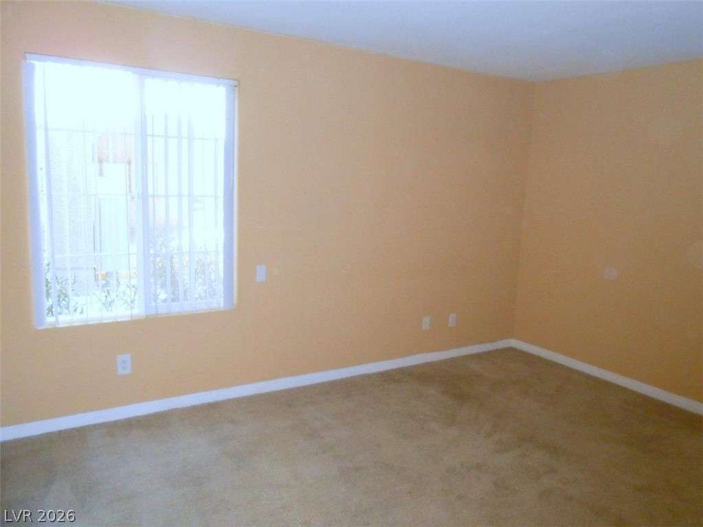 9325 West Desert Inn Road, Unit 132 Las Vegas, NV 89117 - Photo 8 of 36 Well-lit room offering a neutral canvas for your personal style.