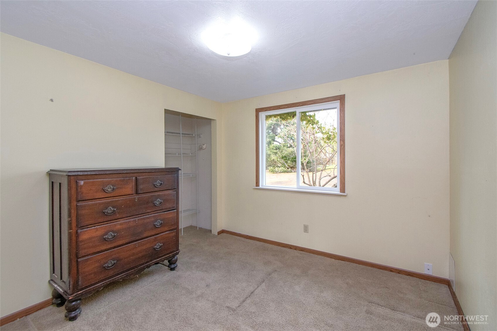62 Hogback Road Sequim, WA 98382 - Photo 17 of 40 a room with a dresser and a window