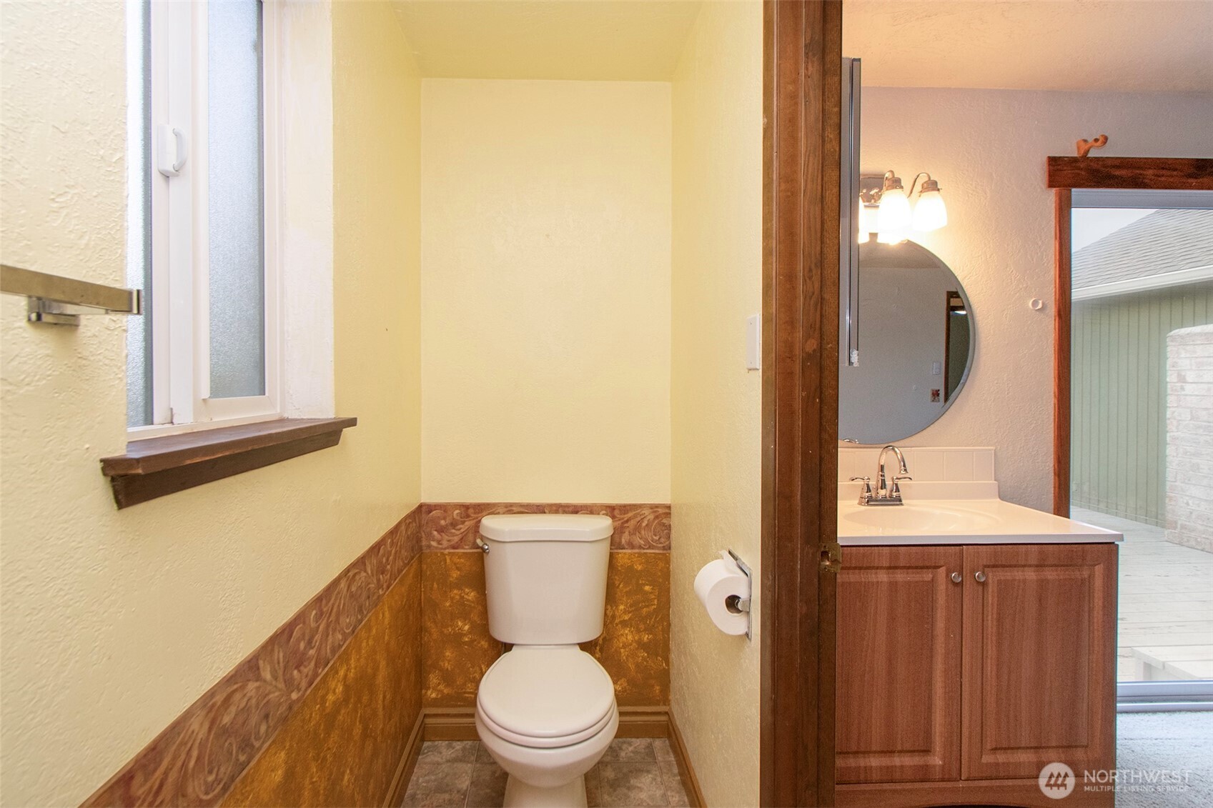 62 Hogback Road Sequim, WA 98382 - Photo 23 of 40 a bathroom with a toilet a sink and mirror