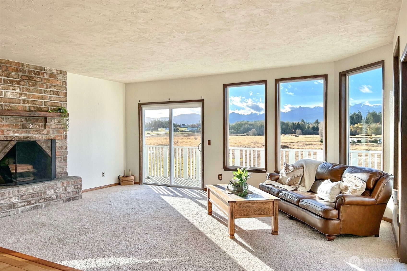 62 Hogback Road Sequim, WA 98382 - Photo 5 of 40 a living room with furniture and a fireplace