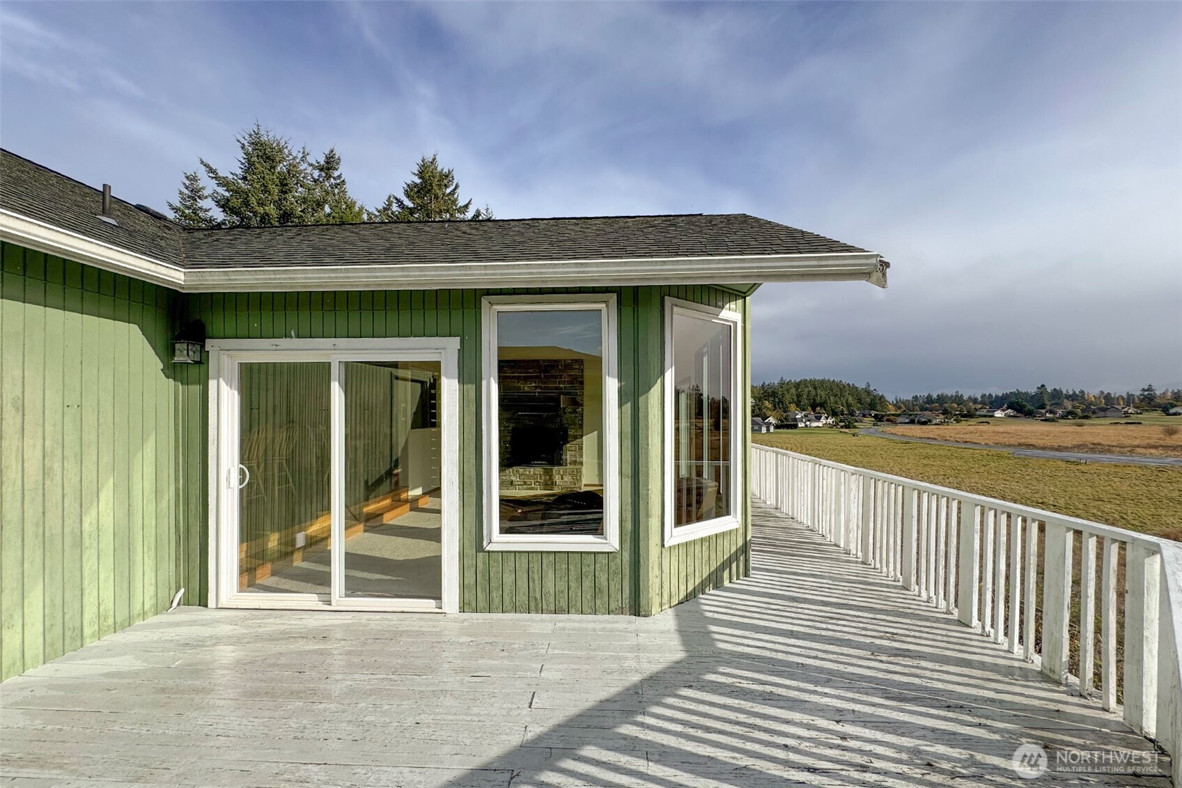 62 Hogback Road Sequim, WA 98382 - Photo 8 of 40 a view of a house with porch and wooden floor