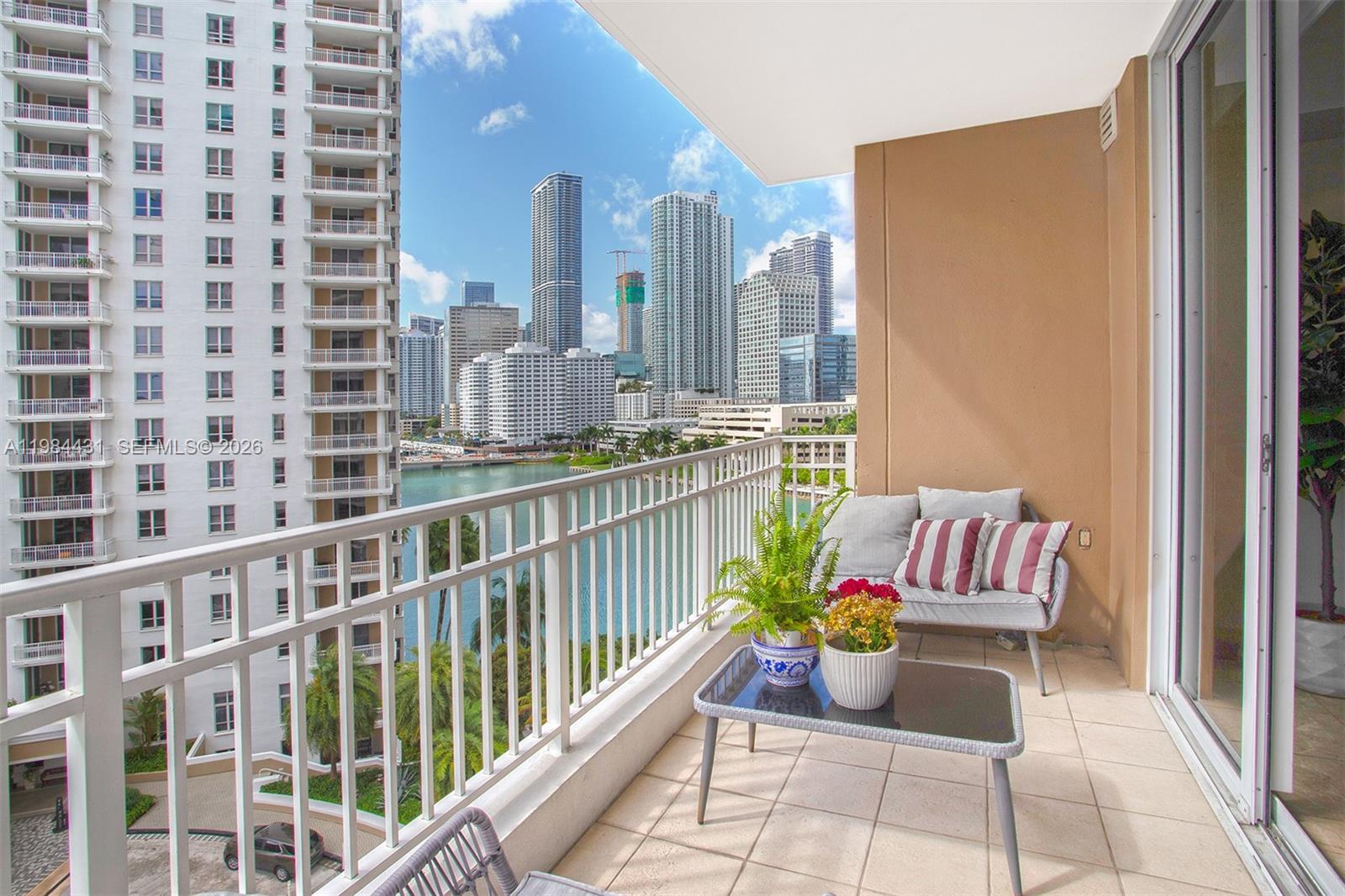 801 Brickell Key Boulevard, Unit 907 Miami, FL 33131 - Photo 18 of 53 a view of a balcony with chairs
