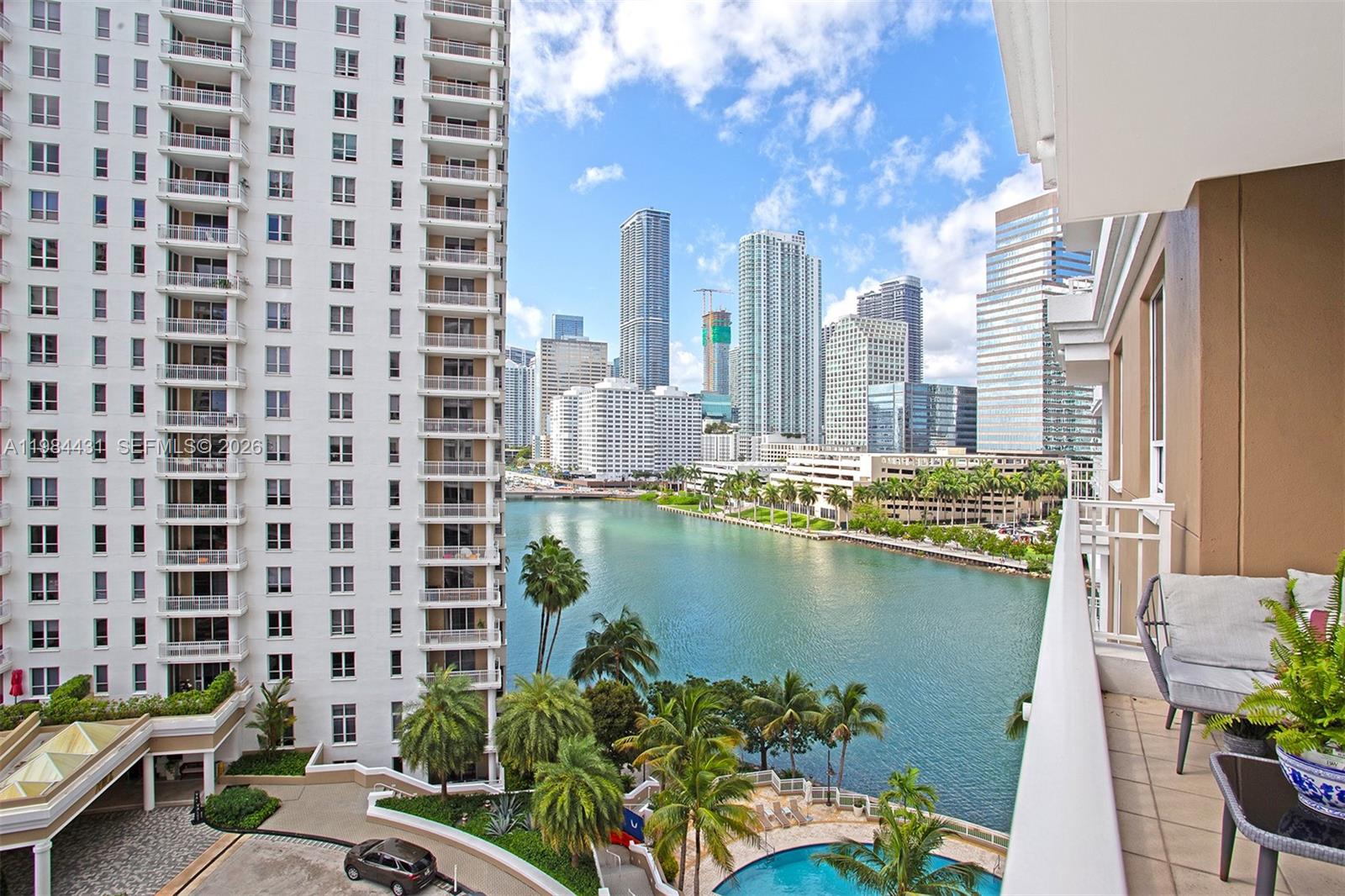 801 Brickell Key Boulevard, Unit 907 Miami, FL 33131 - Photo 20 of 53 a view of swimming pool with outdoor seating and plants