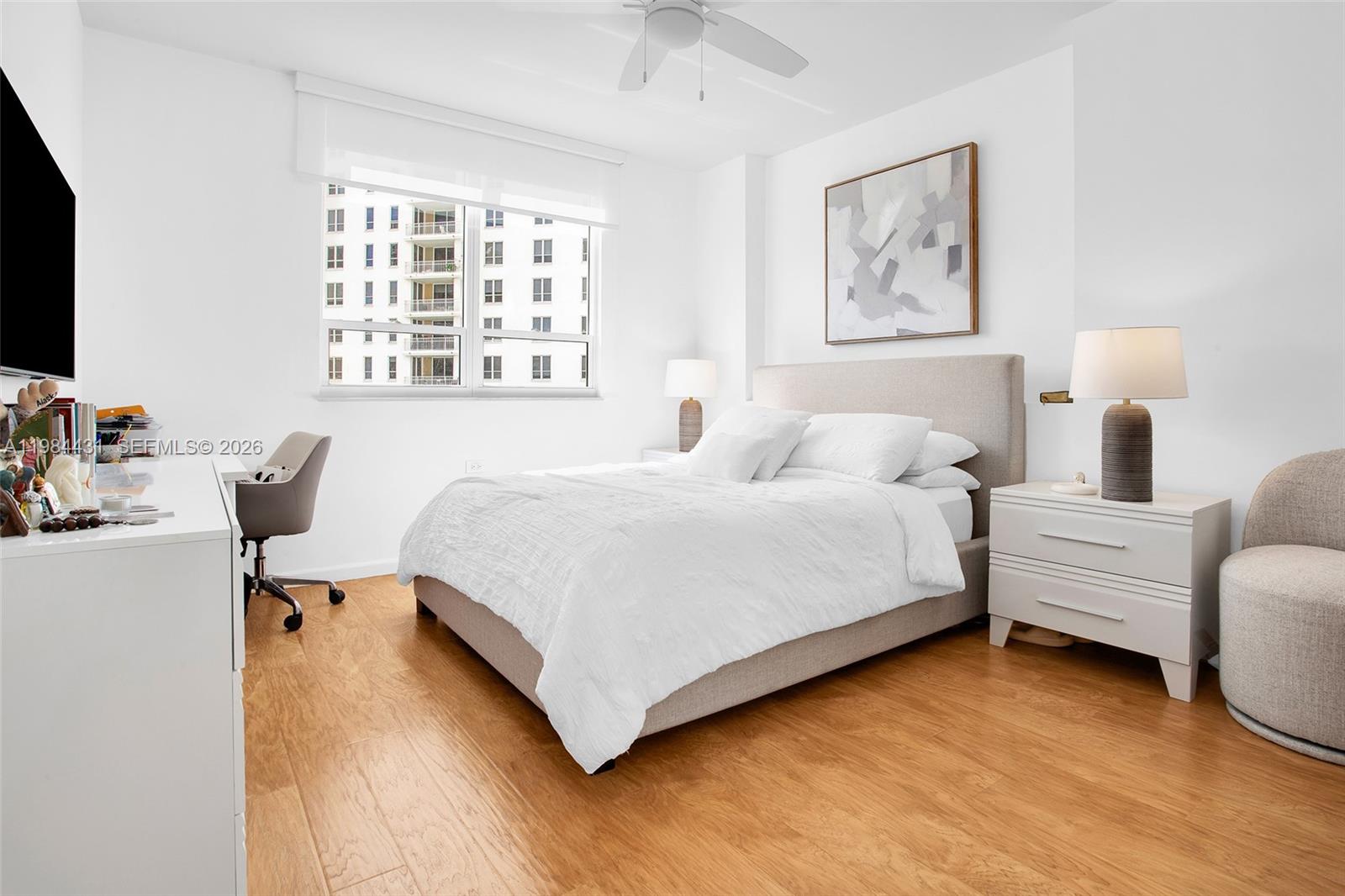 801 Brickell Key Boulevard, Unit 907 Miami, FL 33131 - Photo 23 of 53 a bedroom with a bed and a large window