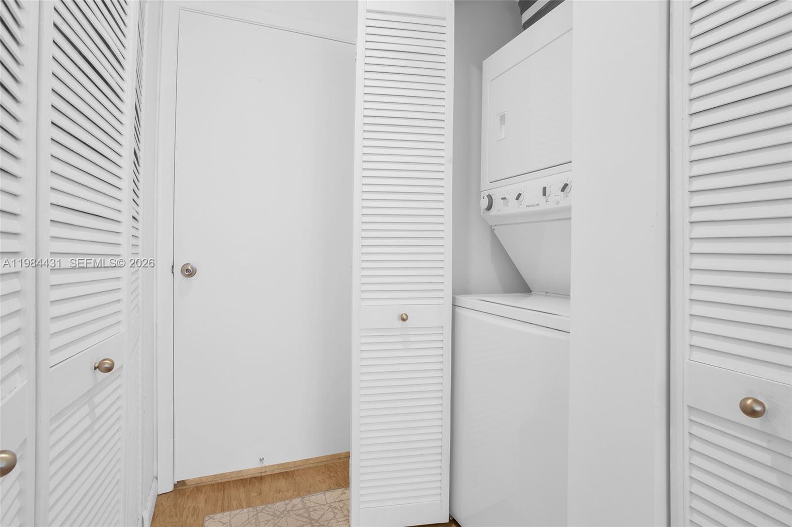 801 Brickell Key Boulevard, Unit 907 Miami, FL 33131 - Photo 28 of 53 a utility room with dryer and washer