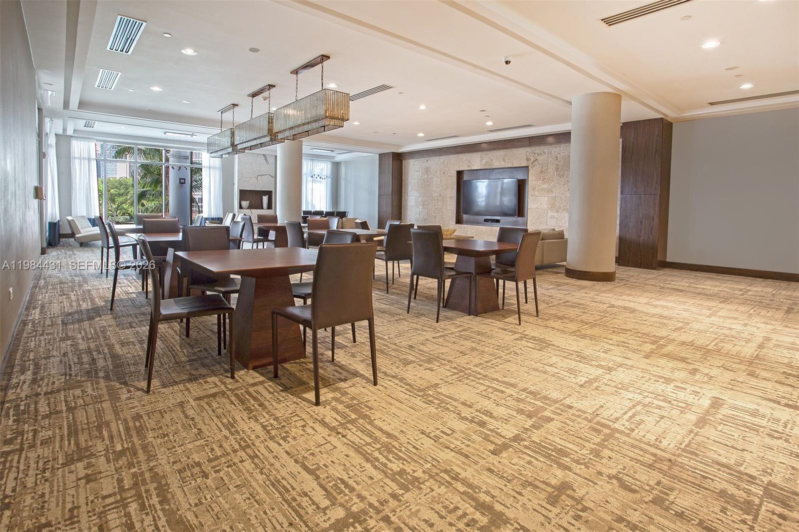 801 Brickell Key Boulevard, Unit 907 Miami, FL 33131 - Photo 32 of 53 a view of a dining room with furniture