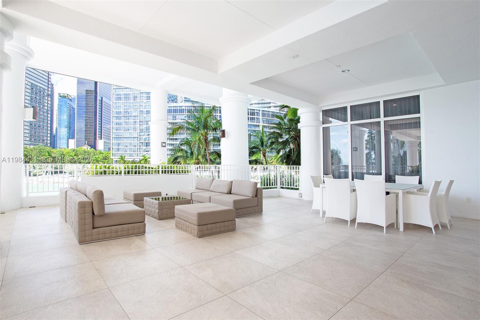 801 Brickell Key Boulevard, Unit 907 Miami, FL 33131 - Photo 34 of 53 a living room with furniture and a large window