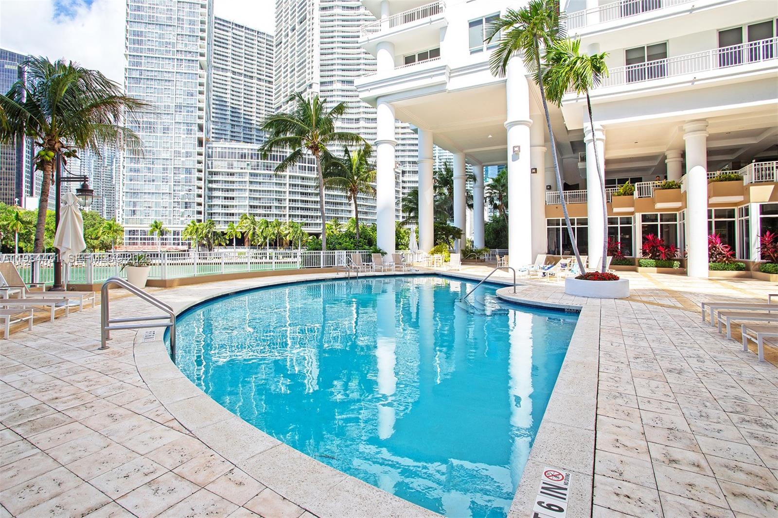 801 Brickell Key Boulevard, Unit 907 Miami, FL 33131 - Photo 36 of 53 a view of a swimming pool with a patio
