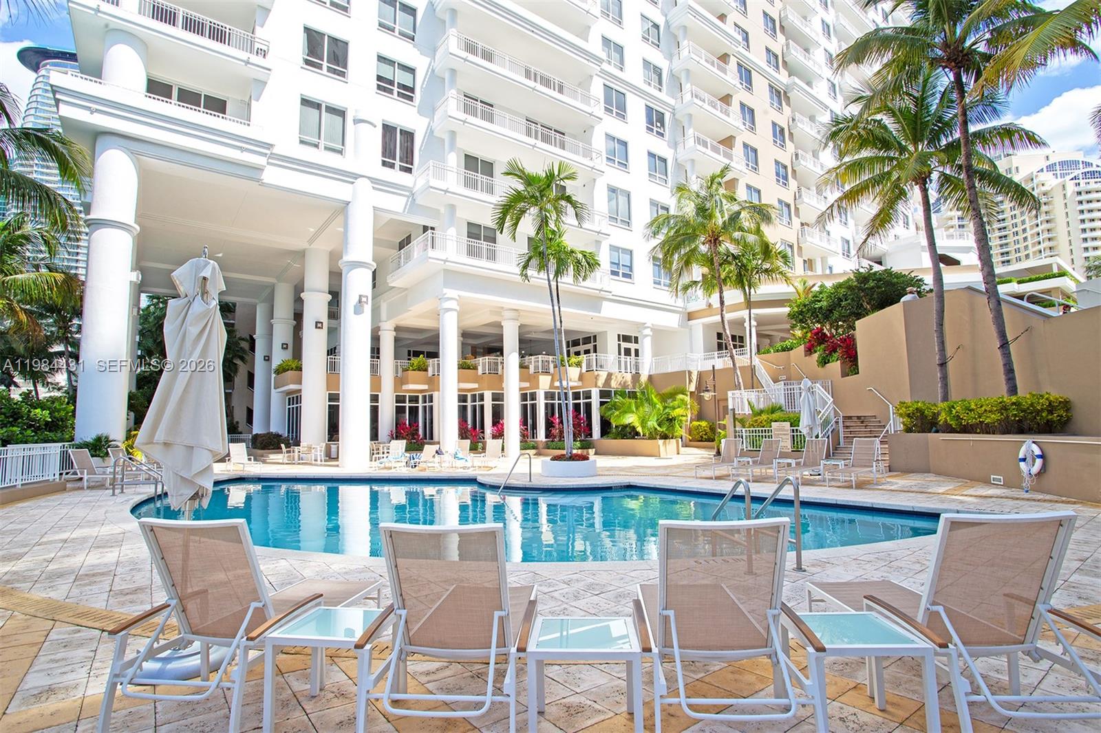 801 Brickell Key Boulevard, Unit 907 Miami, FL 33131 - Photo 37 of 53 a view of a building with a backyard