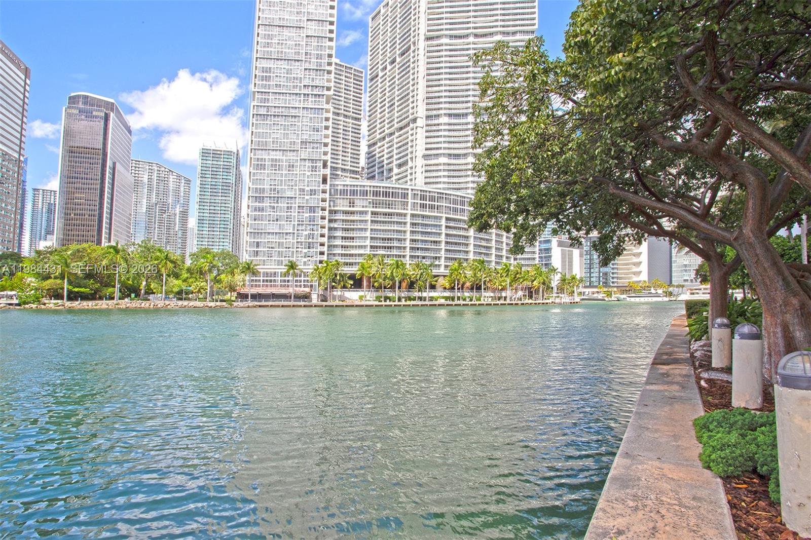 801 Brickell Key Boulevard, Unit 907 Miami, FL 33131 - Photo 46 of 53 a view of a lake with a large building