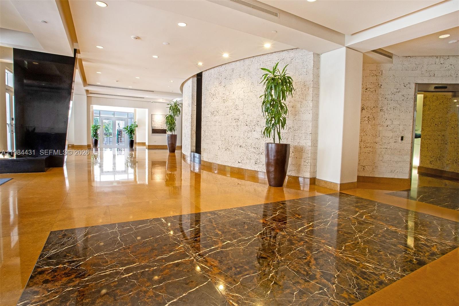 801 Brickell Key Boulevard, Unit 907 Miami, FL 33131 - Photo 50 of 53 a view of a living room with a flat screen tv