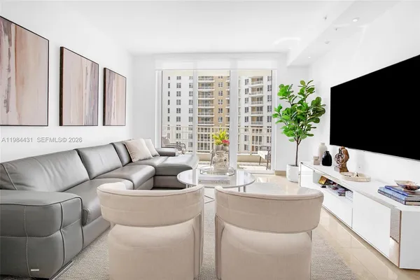 a living room with furniture and a flat screen tv