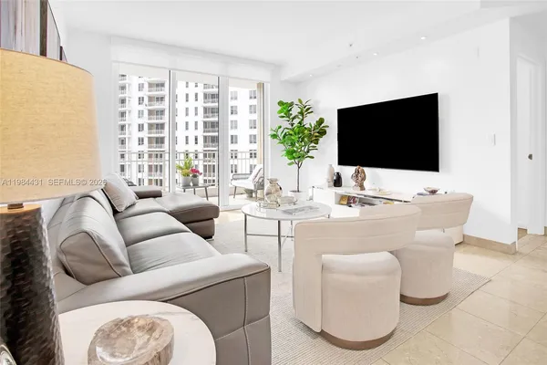 a living room with furniture and a flat screen tv