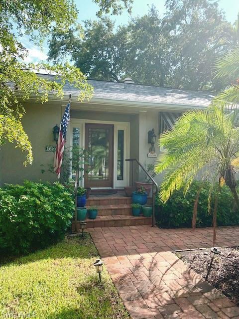 1685 Menlo Road Fort Myers, FL 33901 - Photo 2 of 29 a front view of a house with garden